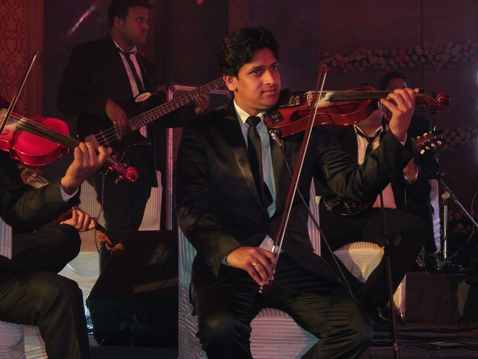 male violin players kuwait city kuwait